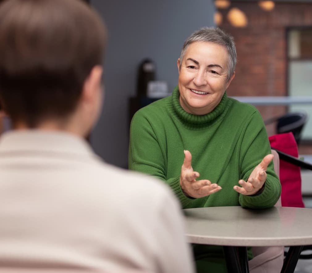 Jane at table with clients
